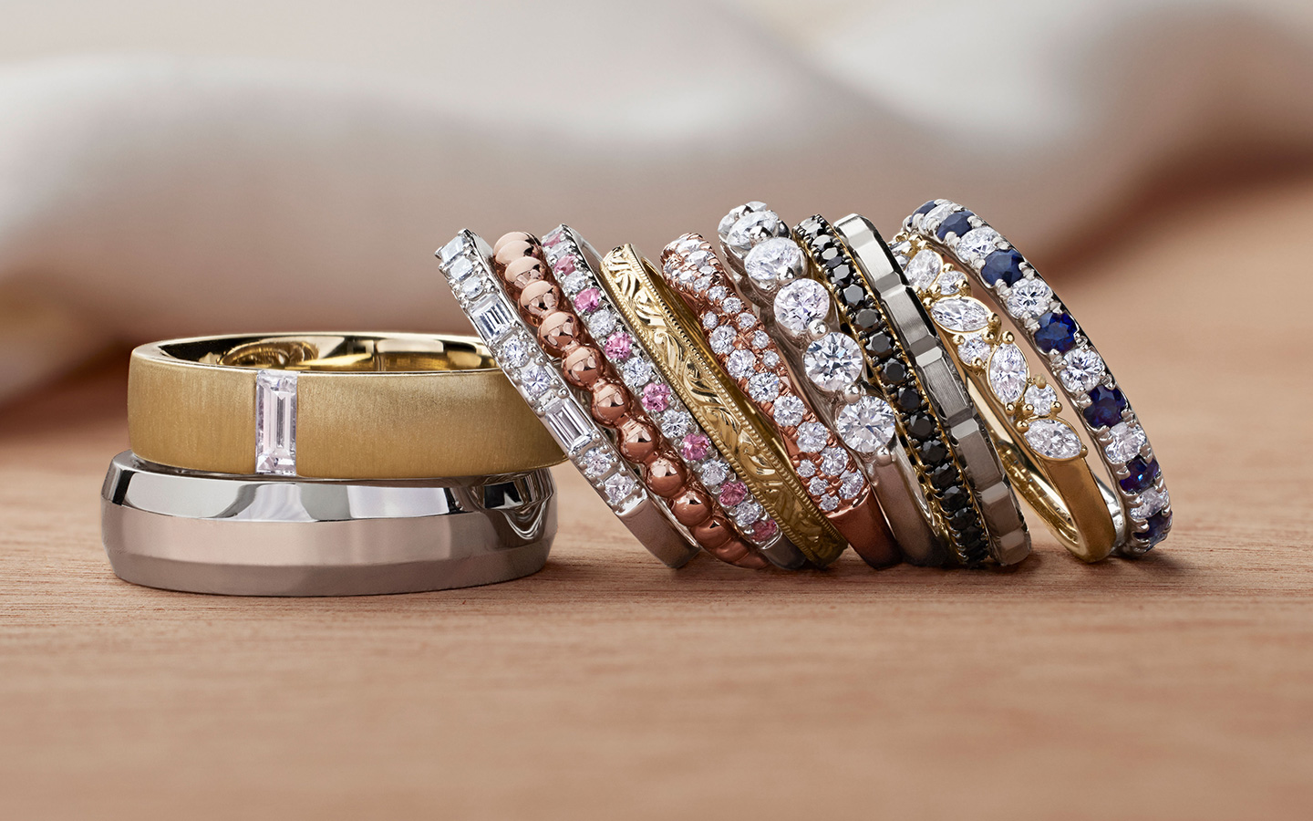 Staked wedding rings in gold and platinum including thin spacer bands.
