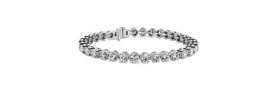 White gold tennis bracelet featuring lab grown diamonds. White gold tennis bracelet featuring lab grown diamonds.